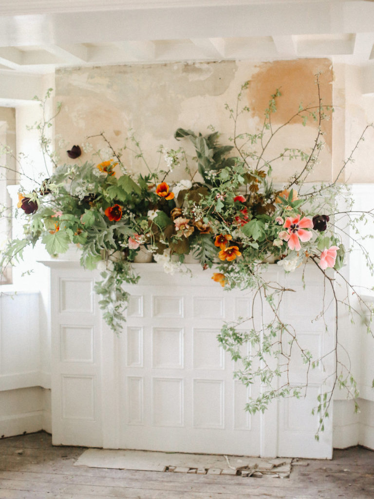 A sprawling floral mantel design by Fiona Pickles