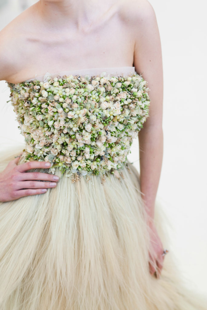 A model wears a fresh flower dress by Zita Elze