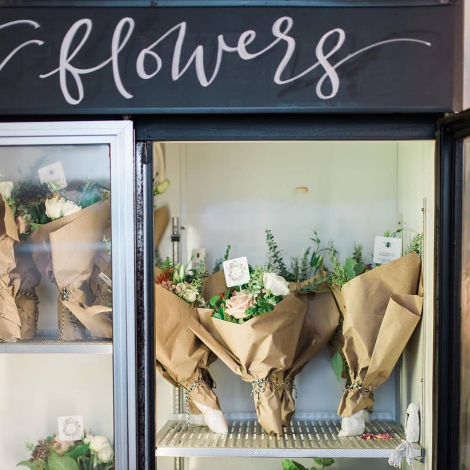 Floral arrangements in a cooler at Bramble & Bee, owned by Mick and Maggie Bailey