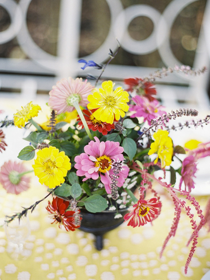 A floral centerpiece with yellow and pink flowers by a BB Expert Panel member