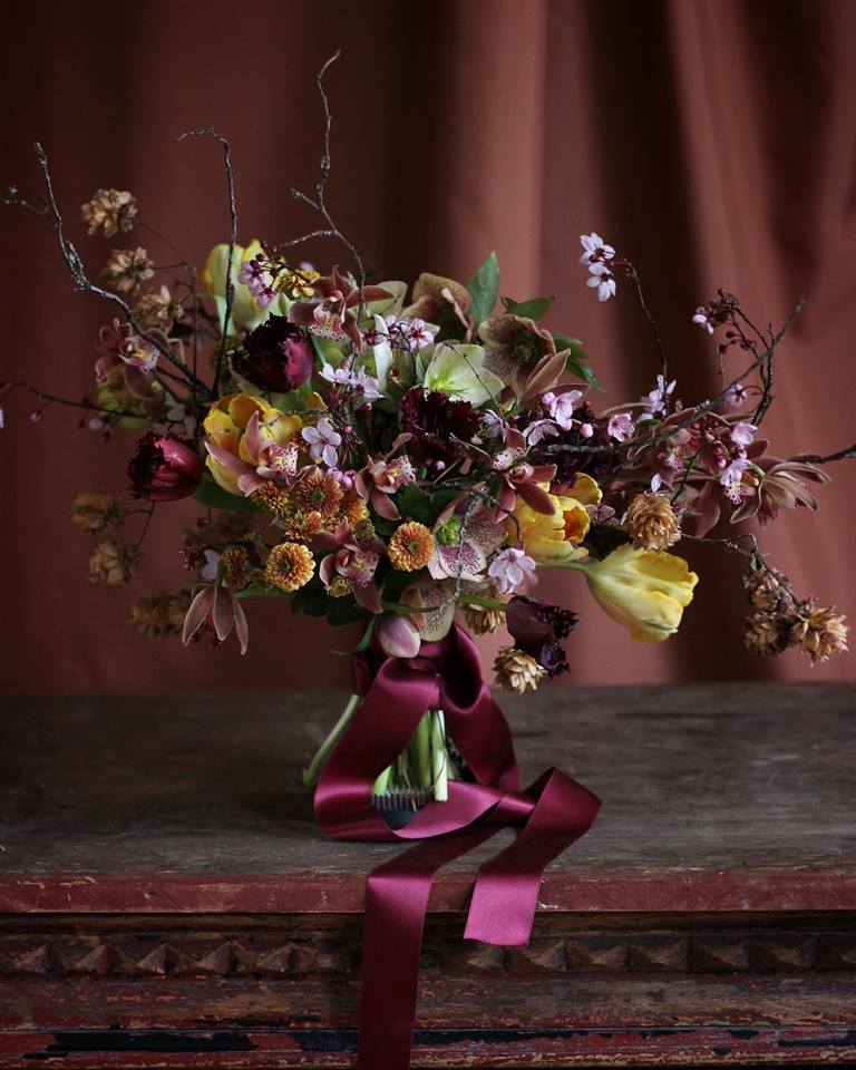 A burgundy and yellow floral design by Christin Geall