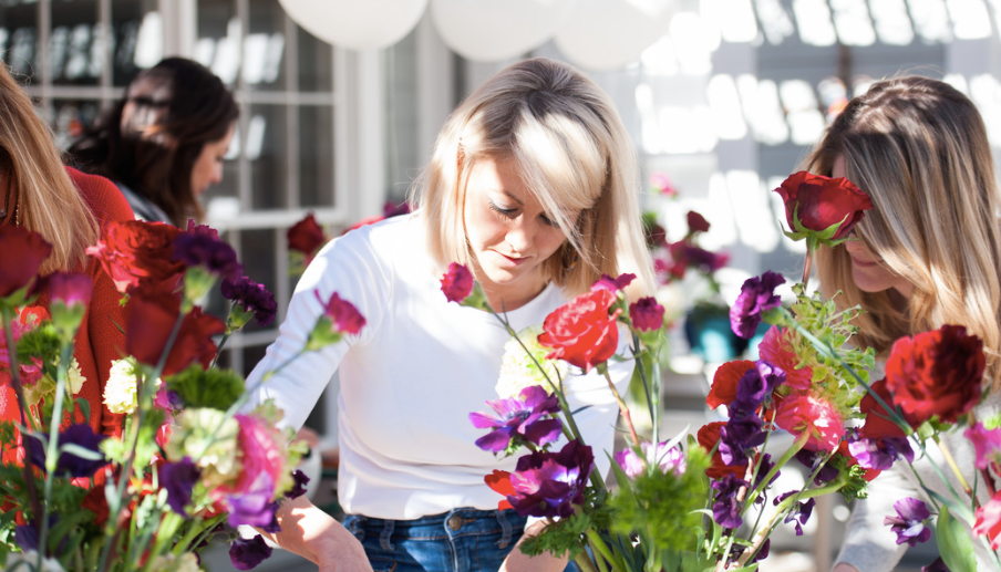 Morgan Anderson helps designers working on floral arrangements