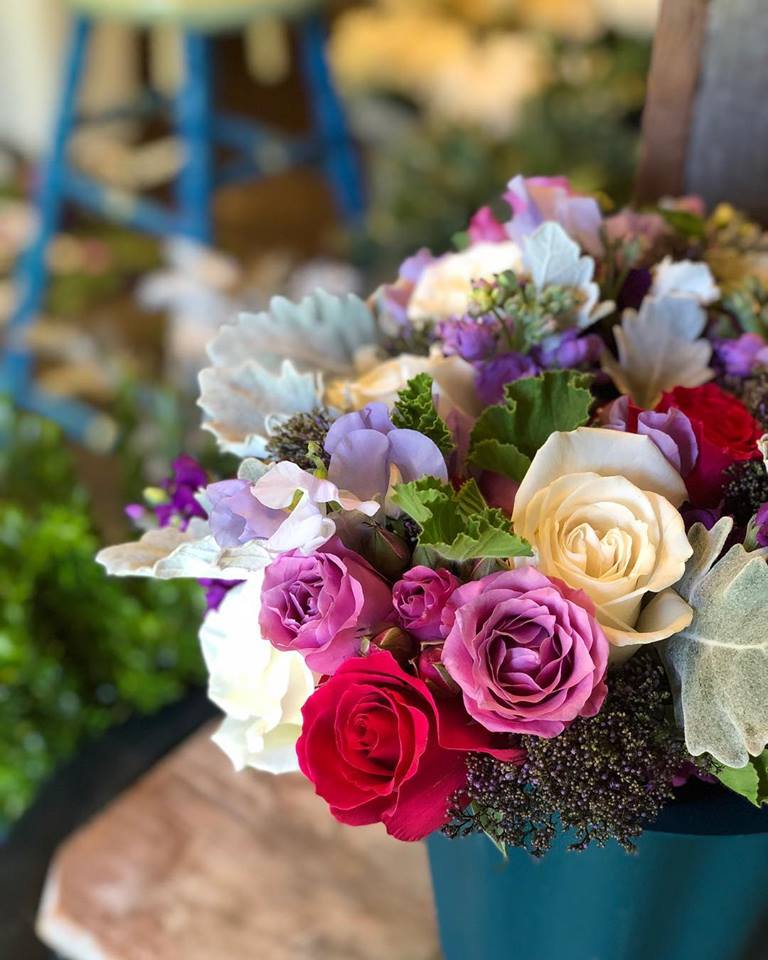 a bucket of fresh flowers for the Master Your Pricing series