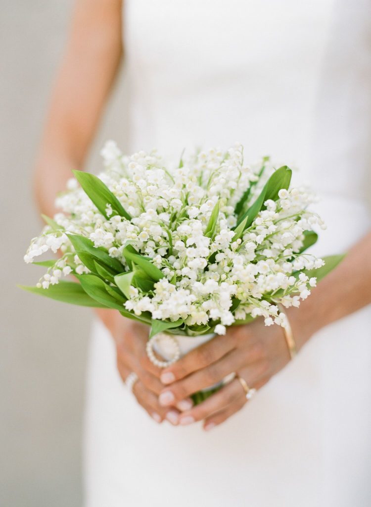 A simple white bridal bouquet by Max Gill