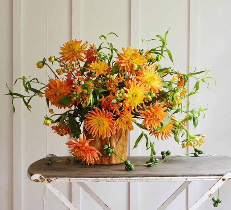 A bright orange arrangement by Robbie Honey