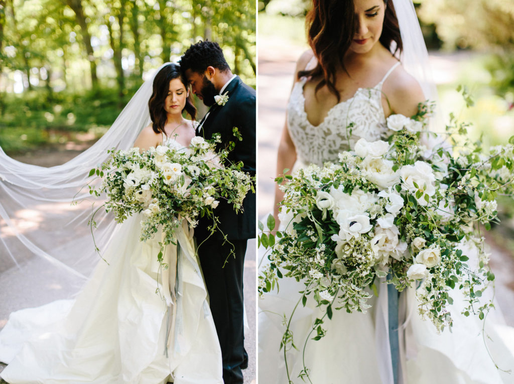 A bride and groom with a white luxury floral bouquet 