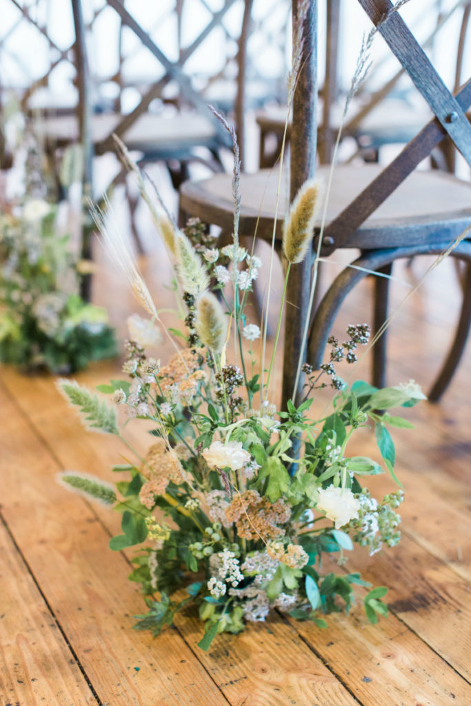 An aisle floral arrangement at the  Mayesh Design Star Workshop