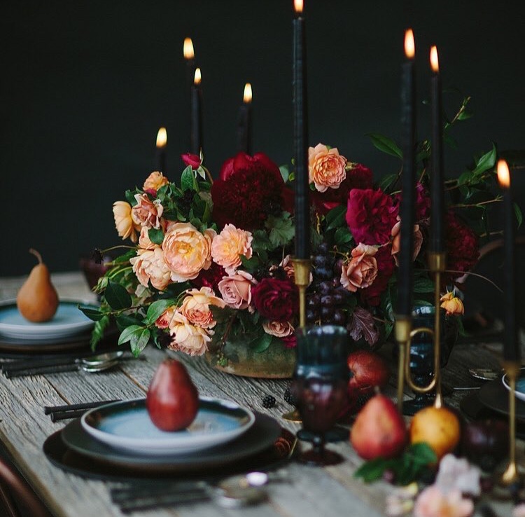 a deep red and orange centerpiece by Kelly Mendenhall