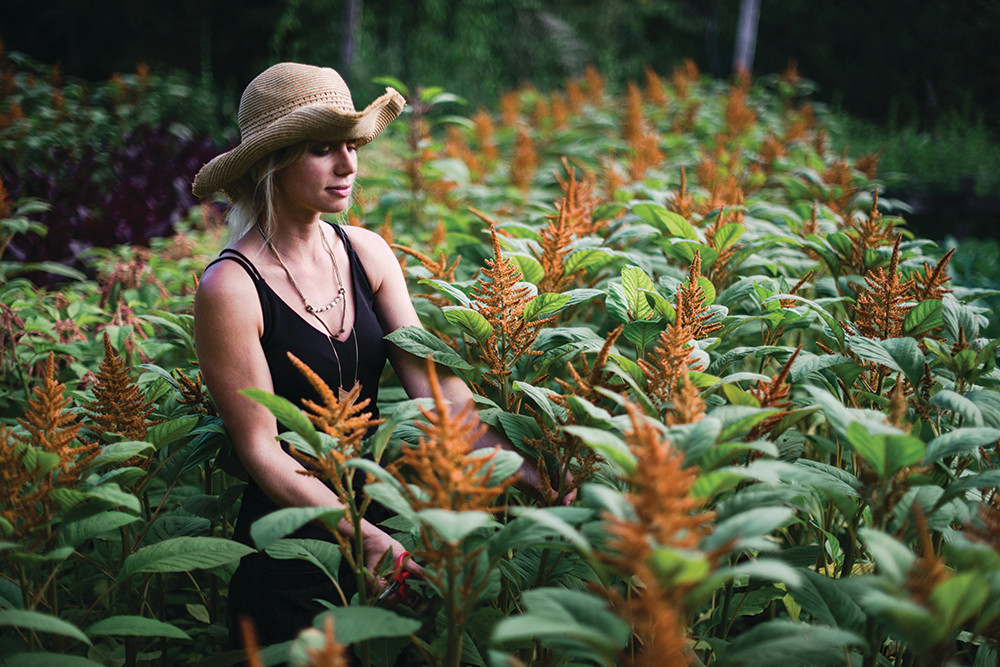 Semia Dunne in a field of orange flowers