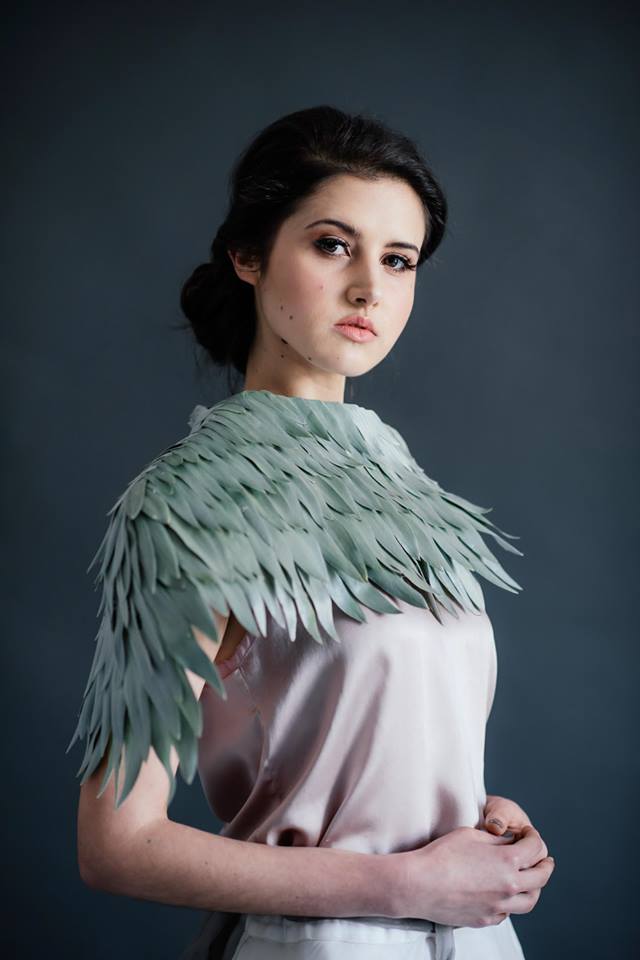 A model wears a floral shoulder piece by Coral Shortt