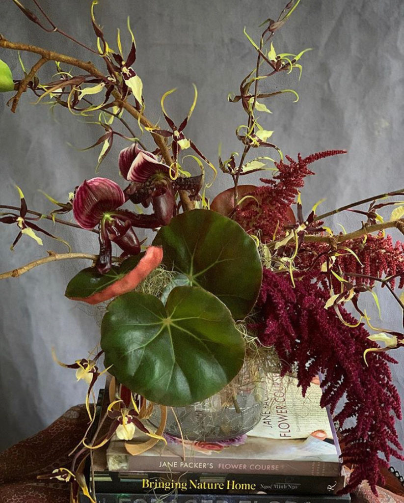 A burgundy floral arrangement designed by Lucia Milan