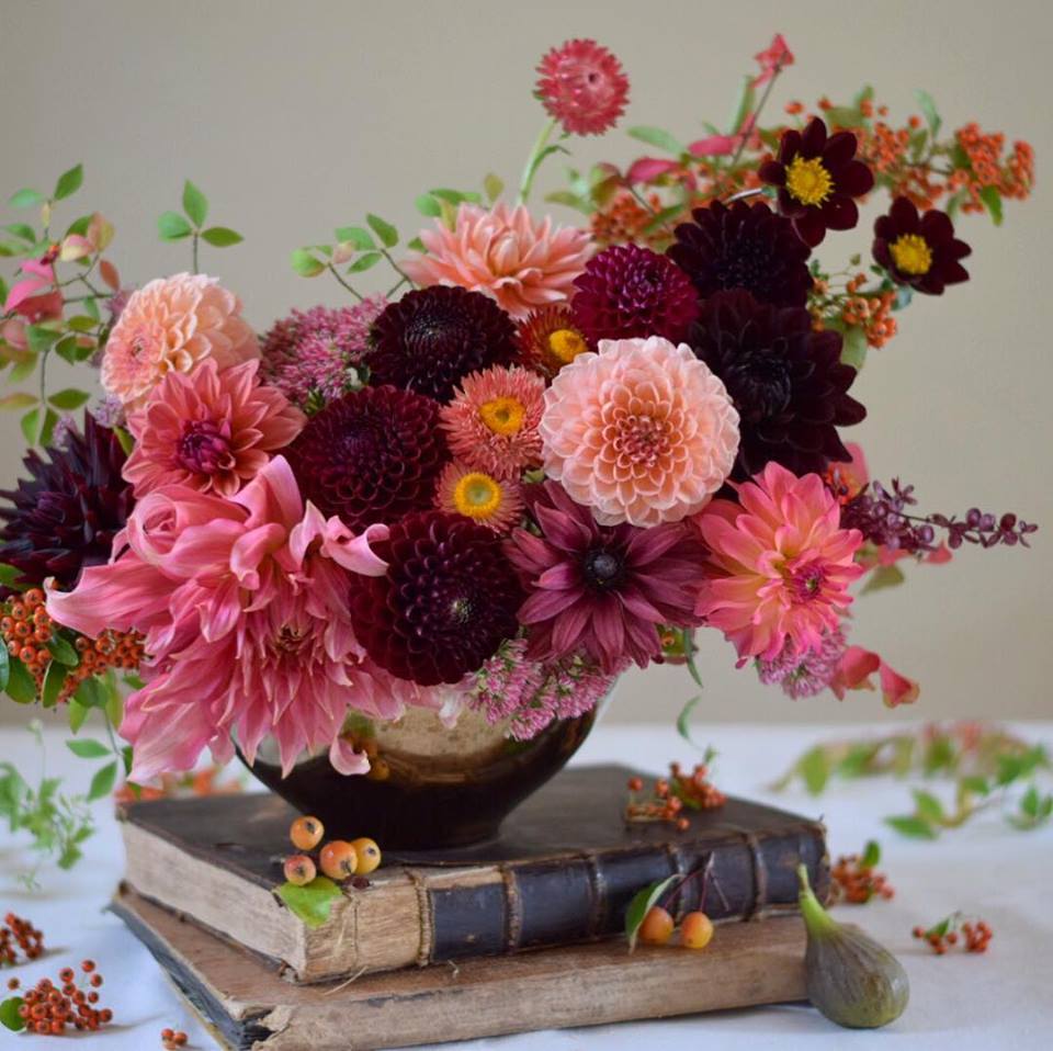 A pink, purple, and maroon floral arrangement by Zoe Woodward
