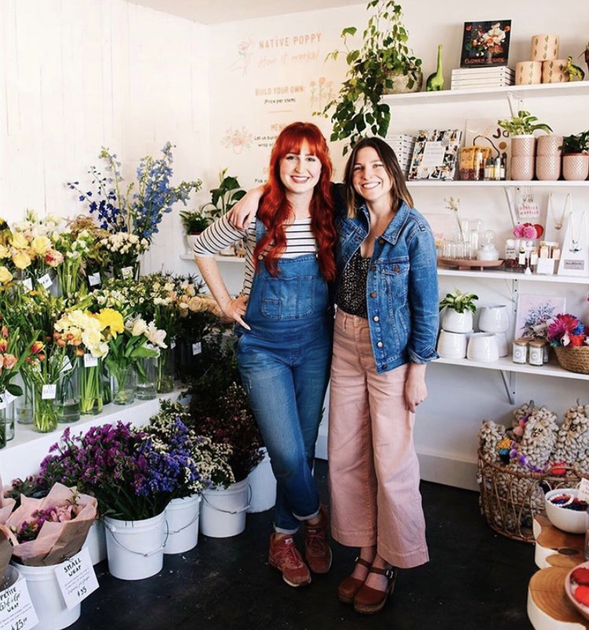 Natalie Gill and Meg Blancato stand in the Native Poppy shop