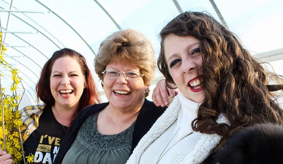 Harmony Harvest Farm owners in the greenhouse