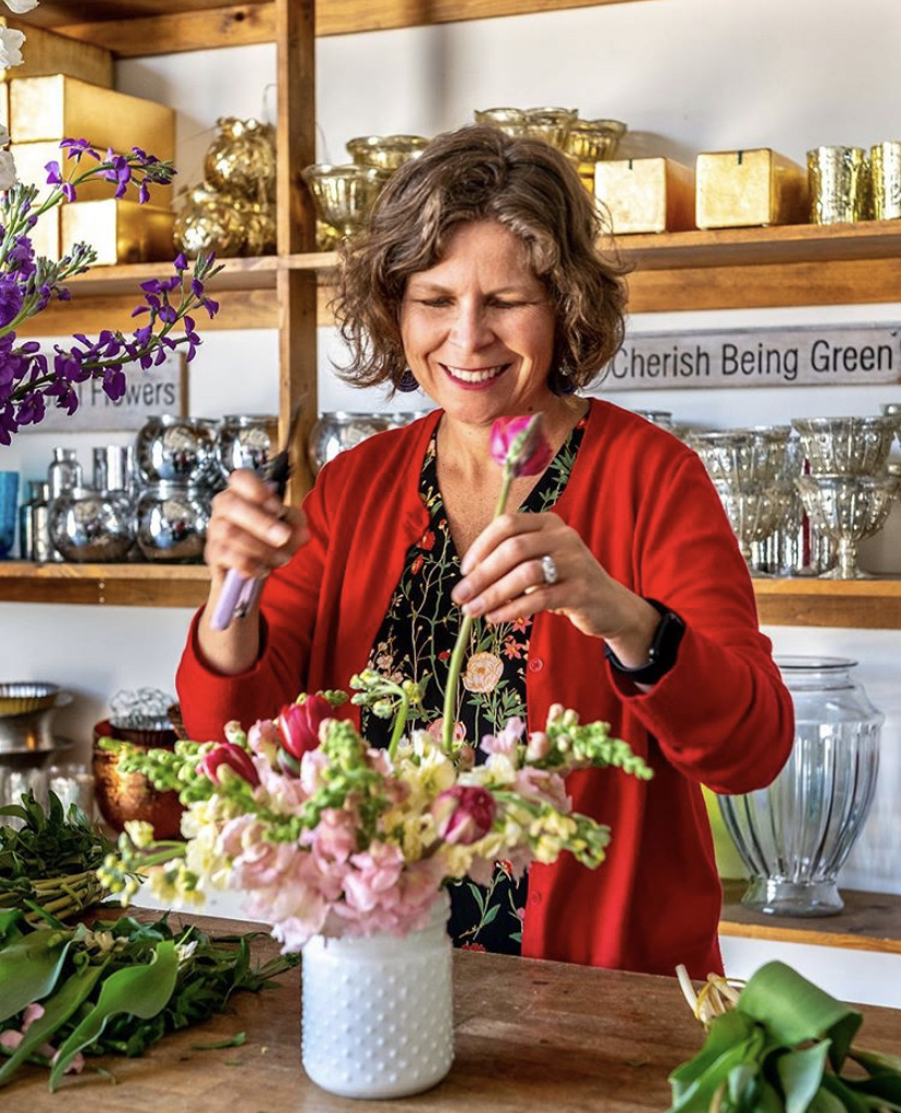 Ellen Frost of Local Color Flowers designing a flower arrangement in her Baltimore Maryland studio