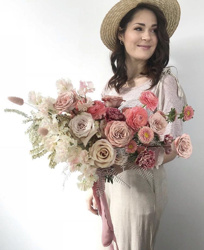 Kate Woodley of Two Wild Hands holding mauve bridal bouquet