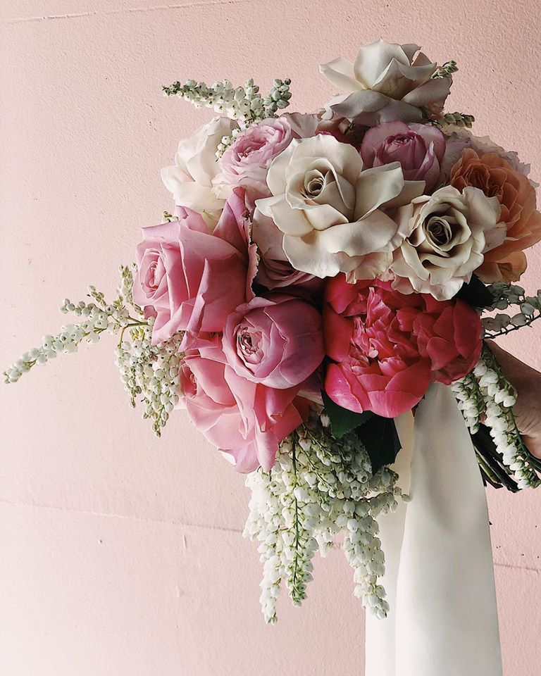 A pink floral bouquet by Rebecca Grace
