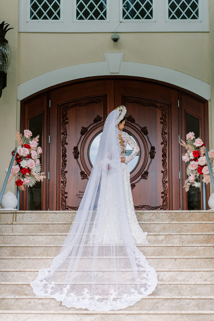 bride on steps of a temple as part of the Vietnamese wedding tradition