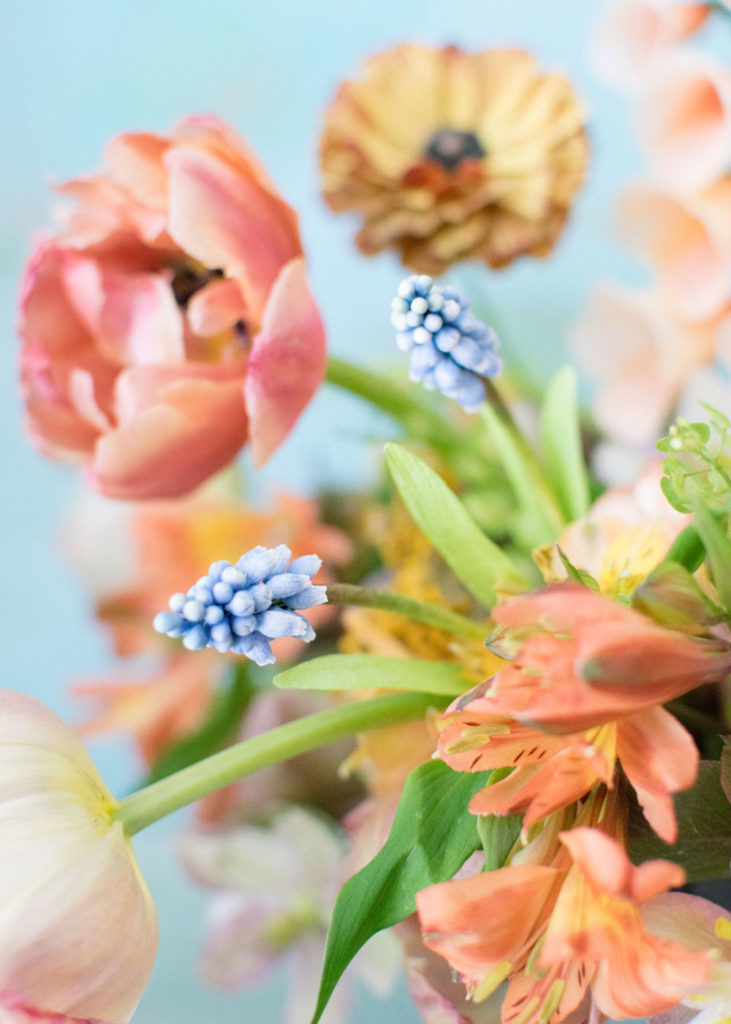 Paper flower muscari in an arrangement of fresh alstromeria and tulips