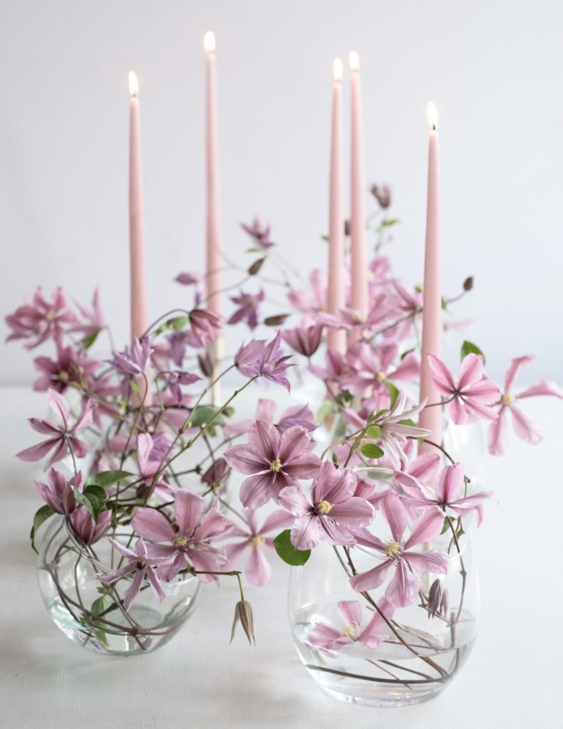 sustainable floral design using twisted twigs for armature to secure clematis blooms