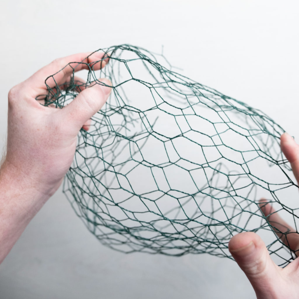 making a ball of chicken wire as an armature for a sustainable floral design