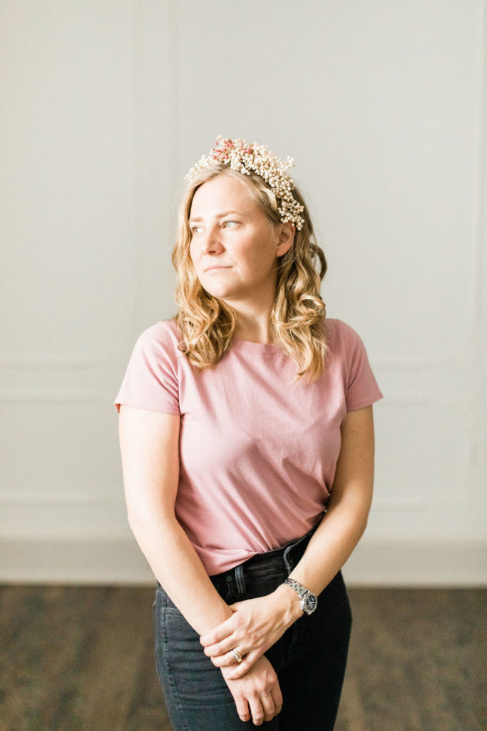 Owner of Bird and Bumble in a wearable floral headpiece she designed