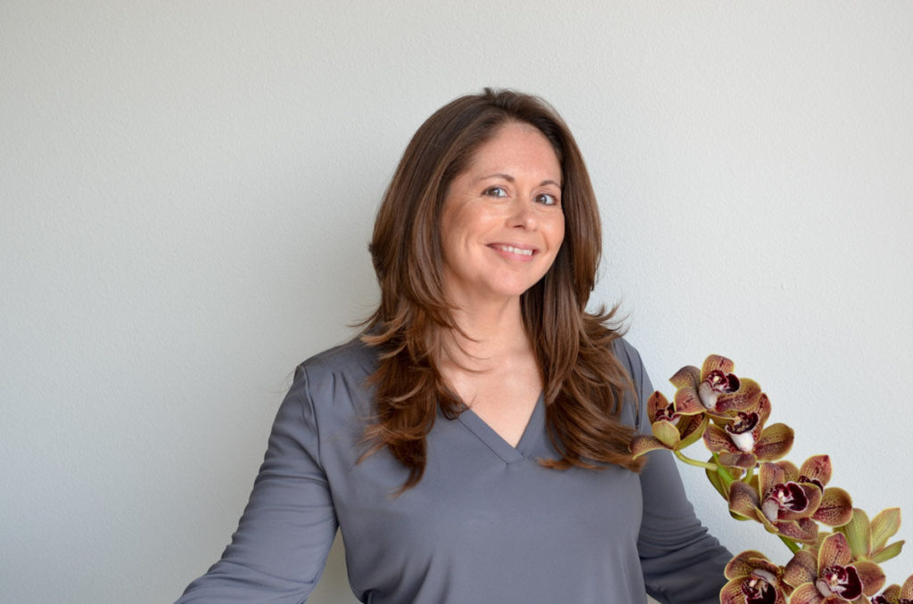 Headshot of LuAnn Dickson, owner of a floral ordering platform called EveryStem